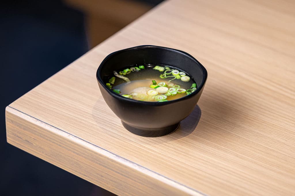 Miso Soup. Traditional Japanese soybean soup with tofu and green onions.